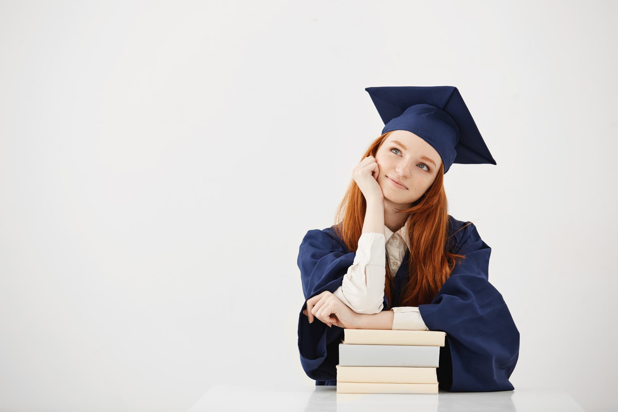 Student smiling with a laptop